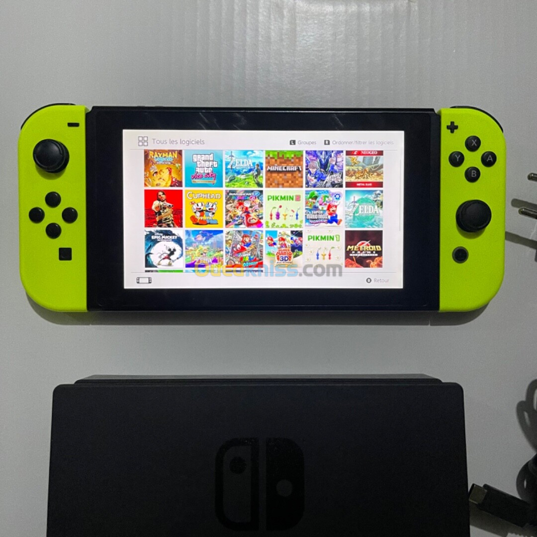 Nintendo switch v1 10/10 sd 128gb flashé avec dock et chargeur 21 jeux installes 