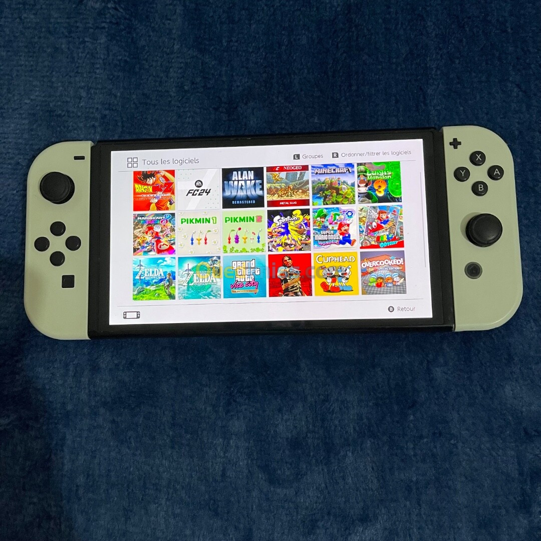 Nintendo switch oled flashé avec puce carte memoire 128gb 29 jeux installés sans accessoires 