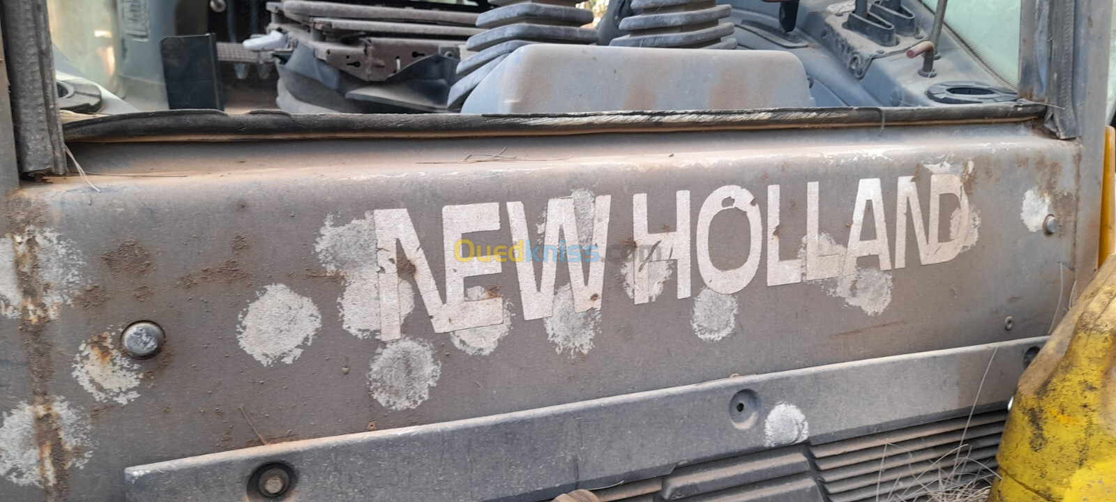 New Holland 110 E 2004