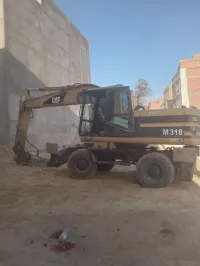 ...... Caterpillar 318M 2002