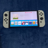 consoles-nintendo-switch-oled-flashe-avec-puce-carte-memoire-128gb-29-jeux-installes-sans-accessoires-oran-algerie