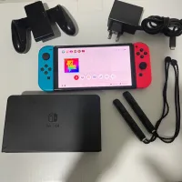 Nintendo switch oled en ligne avec tout les accessoires etat 10/10 comme neuf
