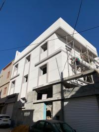 construction-travaux-revetement-de-facade-en-monocouche-bir-el-djir-oran-algerie