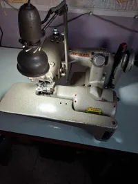Machine à coudre point invisible 