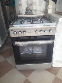 CUISINIER THOMSON INOX VENTILER GAZ/ELECTRIQUE 
