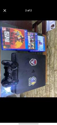 أجهزة-ألعاب-الفيديو-ps4-slim-online-512-gb-avec-mannet-original-10-jeux-installe-et-3-cd-gtav-battlefield-rdd2-etat-910-باش-جراح-الجزائر