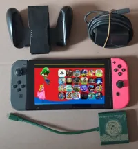 NINTENDO SWITCH FLASHÉE + MINI DOCK TV + CHARGEUR D'ORIGINE + SUPPORT JOYCONS + 24 JEUX INSTALLÉS -