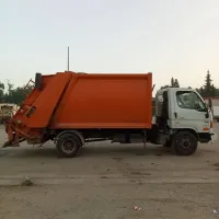 Camion à benne tasseuse