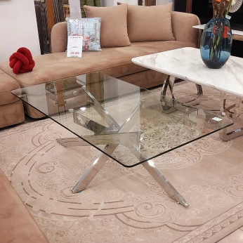 Table basse en verre trempé avec un socle en inox silver