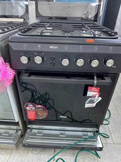 Cuisinière winor 4 feux Four ventilé inox 