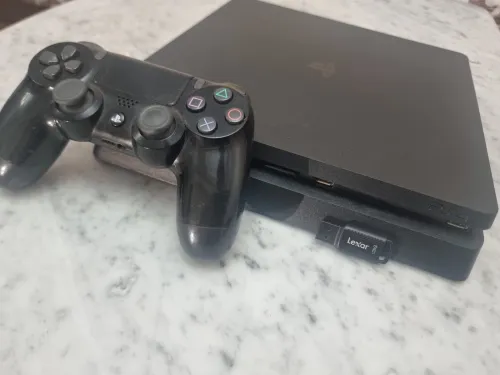 PS4 SLIM 1TB مفلاشي اصدار 12.02 بدون قرص +20 لعبة+فلاش ديسك 128GB