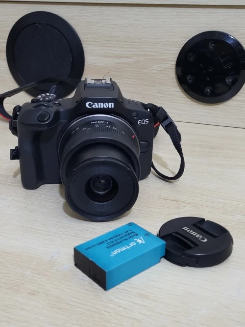 Canon EOS R100 hybride APS-C 24.1 MP - Vidéo 4K 30p - AF CMOS Dual Pixel - Viseur OLED - Wi-Fi/Bluetooth + Objectif stabilisé RF-S 18-45mm f/4.5-6.3 IS STM