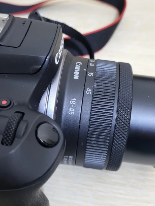 Canon EOS R100 hybride APS-C 24.1 MP - Vidéo 4K 30p - AF CMOS Dual Pixel - Viseur OLED - Wi-Fi/Bluetooth + Objectif stabilisé RF-S 18-45mm f/4.5-6.3 IS STM