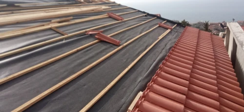 Travaux de tuile et charpente