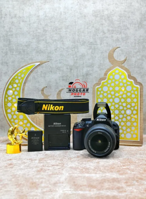 Nikon D3100 + 18-55 mm