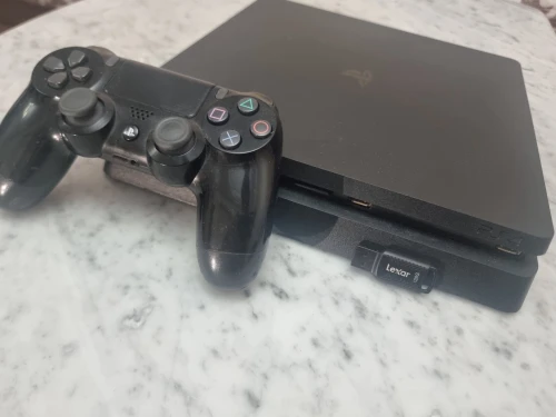 PS4 SLIM 1TB مفلاشي 12.02 بدون قرص +20 لعبة+ فلاش ديسك 128GB
