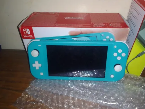 Nintendo switch lite flashée avec sa boit
