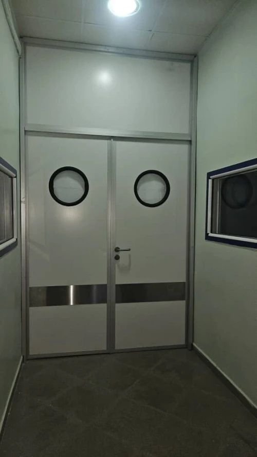 Porte de service semi-isolée à 2 vantaux avec joint inférieur automatique