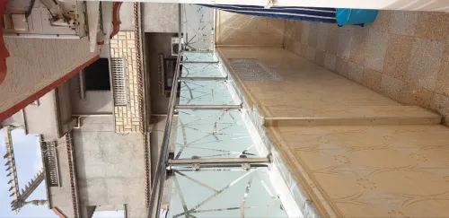 RAMPES D'ESCALIER EN INOX ET VERRE