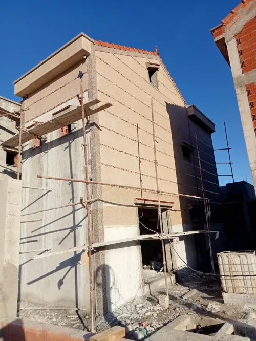 Revêtement et traitement de façade en mignonette et Grain de marbre 