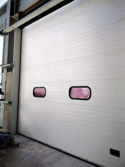 Porte Sectionnelle industrielle et résidentielle en panneau sandwich (أبواب  مقطعية صناعية منزلية)