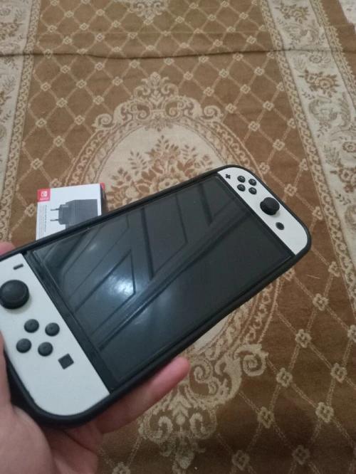 Nintendo switch oled flache + chargeur neuf + 35 jeux