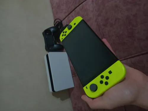 Nintendo switch oled état neuf +40 jeux