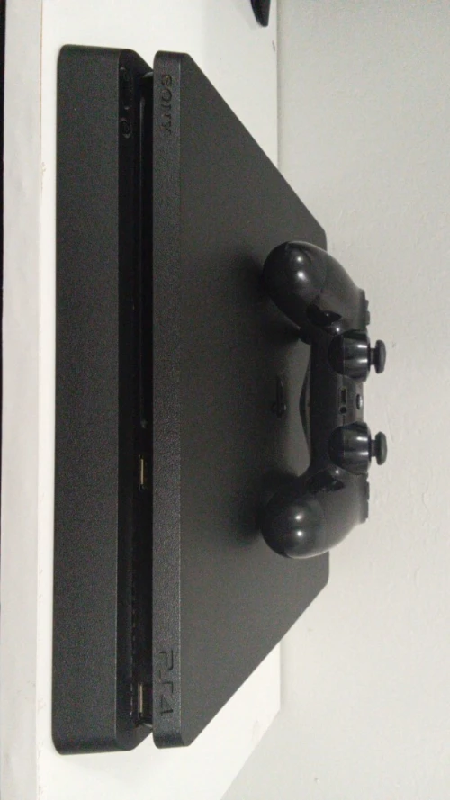 Playstation 4 slim 1TB + 1 manette sans fil original