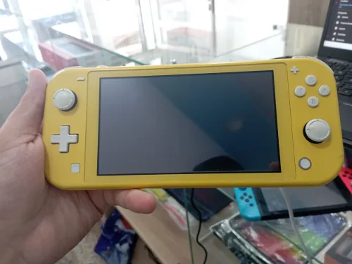 Nintendo Switch Lite flashé 64gb carte memoire