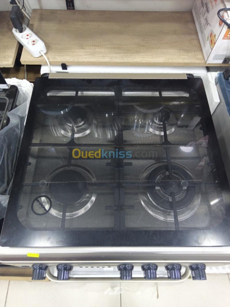 Promo cuisinière Thomson ventilé 4 feux inox fonte-wok TABOUNA avec afficheur 4
